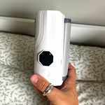 White Handheld Electronic Device with Black Display Window and Button
