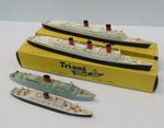 Two boxed Tri-Ang ships; Queen Elizabeth, Mary and two others