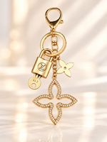 Authentic Louis Vuitton Lock & Key with Unbranded Clover Charm, Keychain