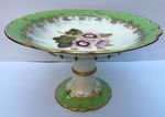 Antique pedestal comport dish. Green, gold & white with hand painted flowers