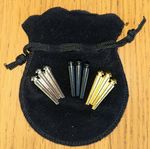 Cribbage Pegs 9no  metal pegs complete with black felt   drawstring bag  