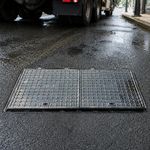 Heavy-Duty Cast Iron Manhole Cover with Keyhole Access for Construction Site