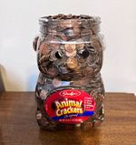 Lincoln Memorial Small Cent full plastic container of pennies.