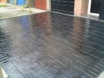 Imprinted concrete coloured driveway sealer paint charcoal grey,black, top coat