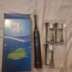 with charger and 6 new heads Sonicare 9900 Prestige SenseIQ Electric Toothbrush