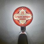 Brand New Cruzcampo Beer Badge! Cruzcampo Pump Badge! Cruz campo Frog Eye Lens