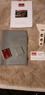 Rover Pin Badge, Handbook Cover, ICE Instructions and Ice Scraper all late 80s.