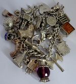 Vintage 108.5g solid silver charm bracelet &many curious charms,rare,open,moving