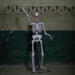 5ft Full Body Halloween Standing Skeleton with Posable Joints & Red LED Eyes