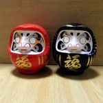 A pair of small Daruma Dolls in red & black colors : No1 size with a marker pen