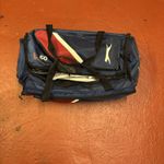 Youth cricket set containing pads, bat, gloves, helmet  and bag