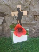 Handmade soldier mounted on a cross with a beautiful poppy graveside memorial 