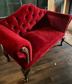 A beautiful and substantial vintage red velvet button-back settee