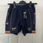 Castore Scarlets Wales Away Junior Replica Rugby Shorts Navy/Gold Size JS