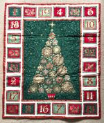Makower Advent Calendar  quilt (shop sample). Green/Red metallic