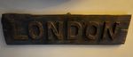 Railwayana sign - LONDON - circa 1900 cast iron lettering on wooden background