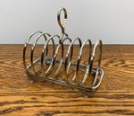 ANTIQUE SILVER PLATE ORNATE FOOTED 6 SLICE TOAST RACK