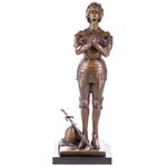 Bronze statue of Joan of Arc on a black marble base after Mercier