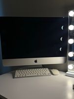 Apple iMac - comes with keyboard, mouse and the plug