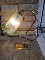 vintage art nouveau brass lamp with bell glass shade.