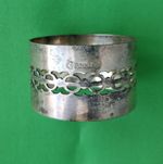 Silver plated EPNS napkin ring with cut out design.