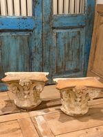 Pair of Italian terracotta cornthium capitals