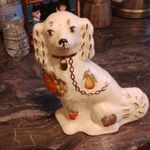 Sitting white ceramic DOG  Spaniel ornament with Fruit & Foliage  painted on it.
