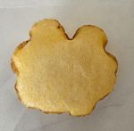 Popped potato chip with almost bunny ear-like shape