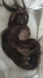 Ariana grande brown hair cut off ponytail, from concert, real thing