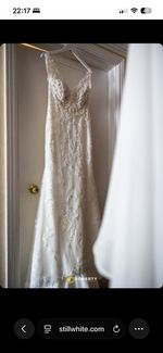 Lillian west wedding dress size 14, long train, lace sides, low back