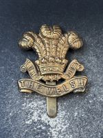 Welsh Regiment, 1916 Economy War Issue British Army Military Cap Badge.