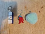 Rubix keychain, red amongus keychain, blue pok pom keychain. 3 pack