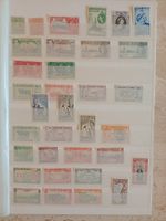 Stamps of British colonies on 4 stockbook sides