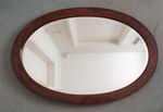 Early 20th century large oval wood  bevelled  edged mirror
