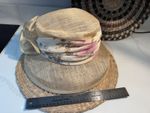beige sinamay hat by Alexon, a British brand known for elegant occasion wear.
