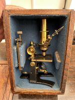 ANTIQUE BRASS MICROSCOPE IN ORIGINAL BOX WITH MECHANICAL STAGE