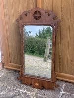 A Georgian Mirror In Mahogany.