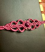 Handmade purple macrame bracelet w/ treated tigers eye, fluorite crystals