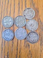 Silver three penny coins.