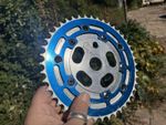 Chrome Tuff Neck Power Disk And Bluer Tuff Neck 44 Tooth Chain Ring Plus Bolts.