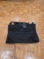 TUMI BAG , GARMENT BAG , TRAVEL BAG, SUIT BAG . TRI FOLD. HARDLY USED
