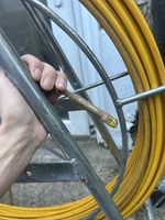 Cobra Cable Puller Yellow Sheath Metal Frame with Wheels - Used