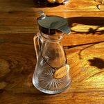 Antique silver-mounted glass whiskey tot jug & silver whiskey label chain