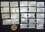 SELECTION OF 23 ANTIQUE FINE CARVED MOTHER OF PEARL GAMING COUNTERS BIRDS ETC.