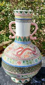Large Chinese Famille Rose vase with dragon motifs and stylized handles 35 cm