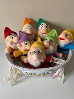 Gorgeous all seven Disney Dwarfs displayed in a Disney Babies wicker basket