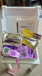 Babycare TENS ELLETENS+ 3-in-1 Labour TENS Machine w/ Electrodes Pink/White.