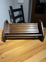 Antique Victorian wooden slatted desktop book rack with angled side panels.
