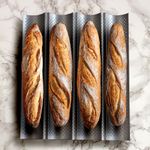 Perforated baguette baking tray