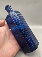 STUNNING COFFIN SHAPED VICTORIAN POISON BOTTLE VARIANT EMB. NOT TO BE TAKEN 8 OZ